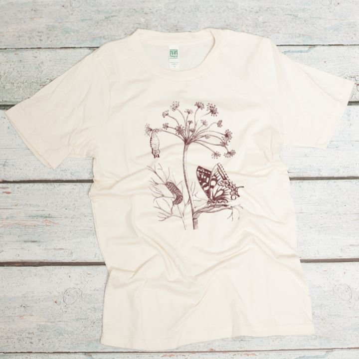 botanical print with plant, butterfly, caterpillar, and pupa in dark brown ink on a natural organic cotton unisex t-shirt
