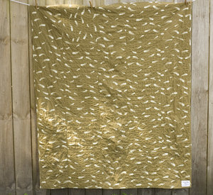 organic cotton rag quilt back with print of feathers on brown background