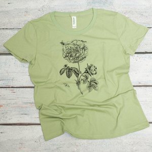 botanical print with flowers and insects screen printed on an avocado colored women's organic cotton tee