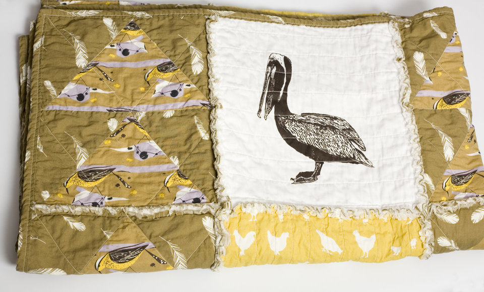 organic cotton rag quilt with screen printed brown pelican