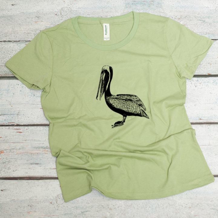 brown pelican screen printed on an avocado colored women's organic cotton tee