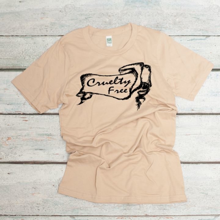 Cruelty Free screen printed in a banner on an organic cotton unisex tee in mushroom color